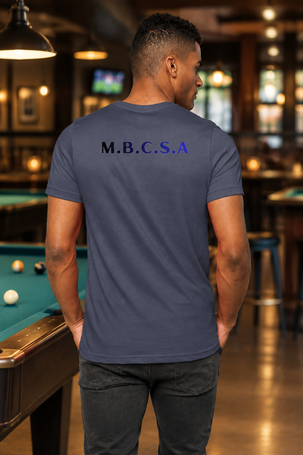 Back model shot of the slate-blue M.B.C.S.A T-shirt