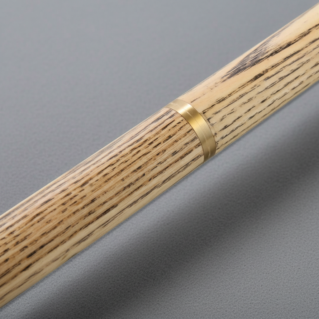 Ash cue shaft detail on grey pool table cloth