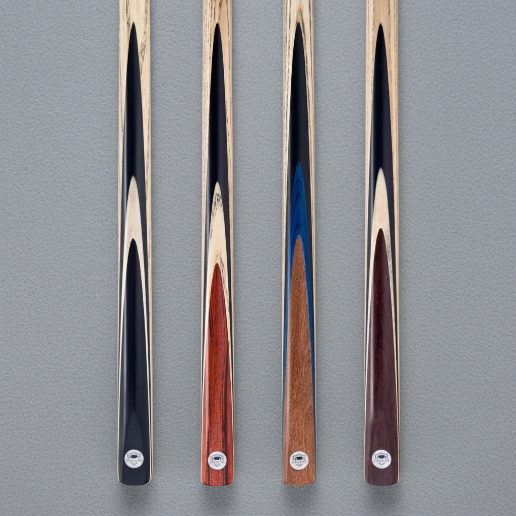 Four PRO147 ash cue designs on grey pool table cloth
